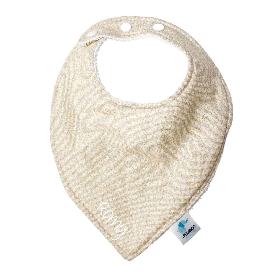 Bavoir - Motifs beige pâle